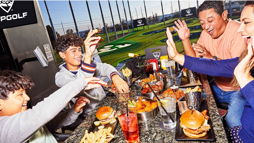 photo of people eating at topgolf